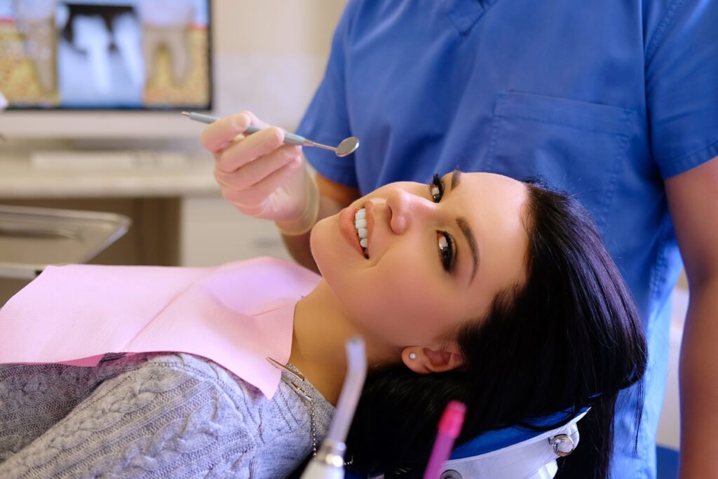 Dentist examining patient’s teeth during a routine dental checkup