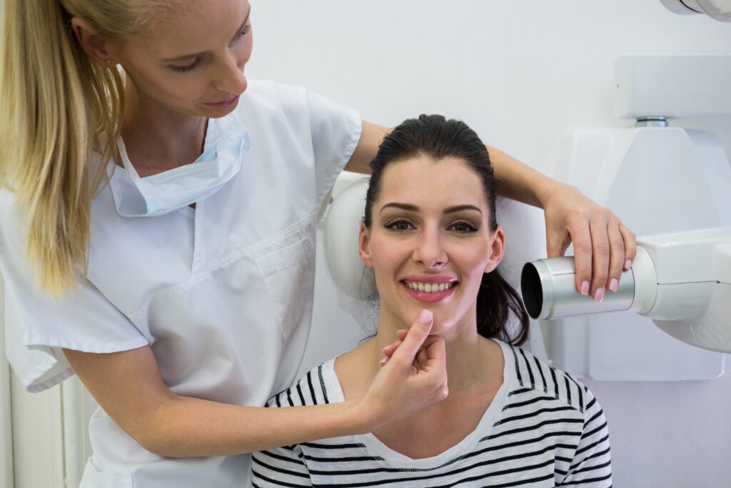 Dentist examining patient’s smile during dental consultation and treatment planning