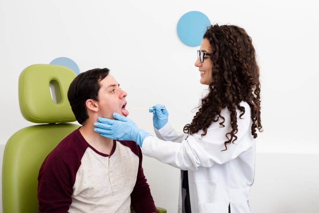 Dentist performing oral swab test during routine dental examination